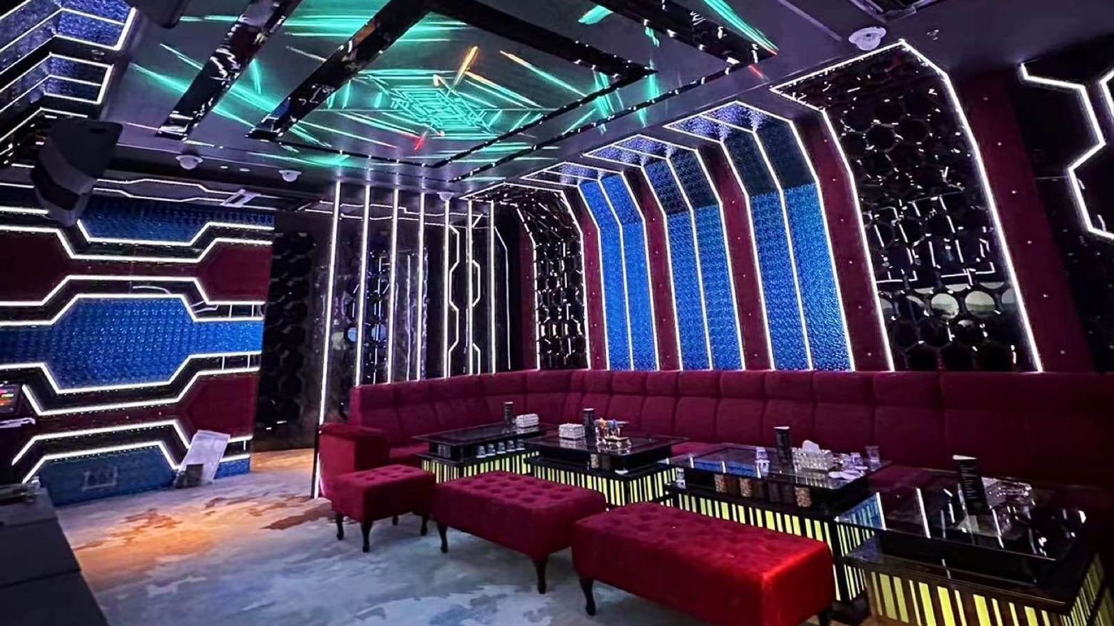 Private KTV room with red sofas and LED walls at Haoman KTV, Prangin Mall, George Town, Penang
